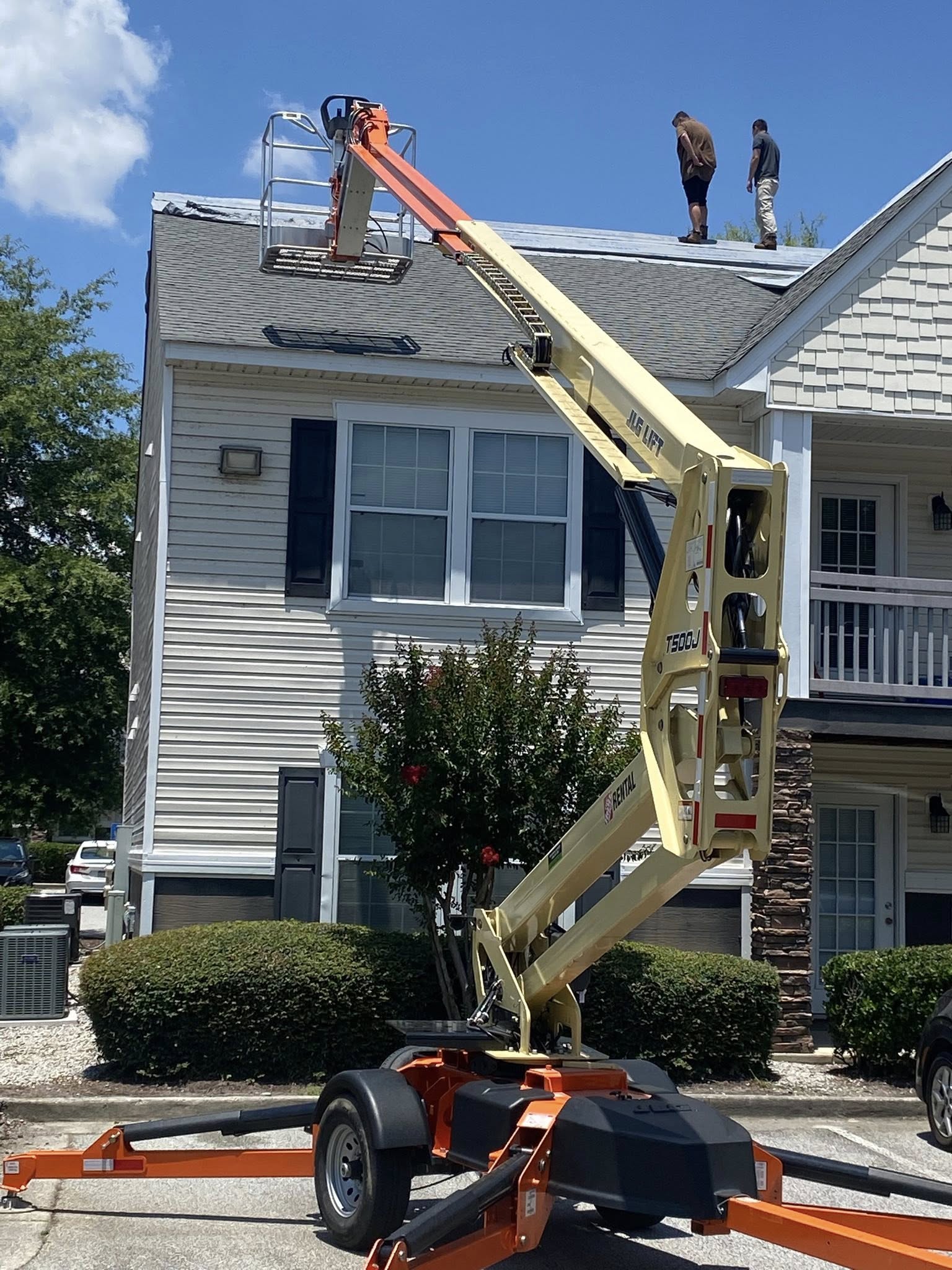 Apartment complex roof repair with lift
