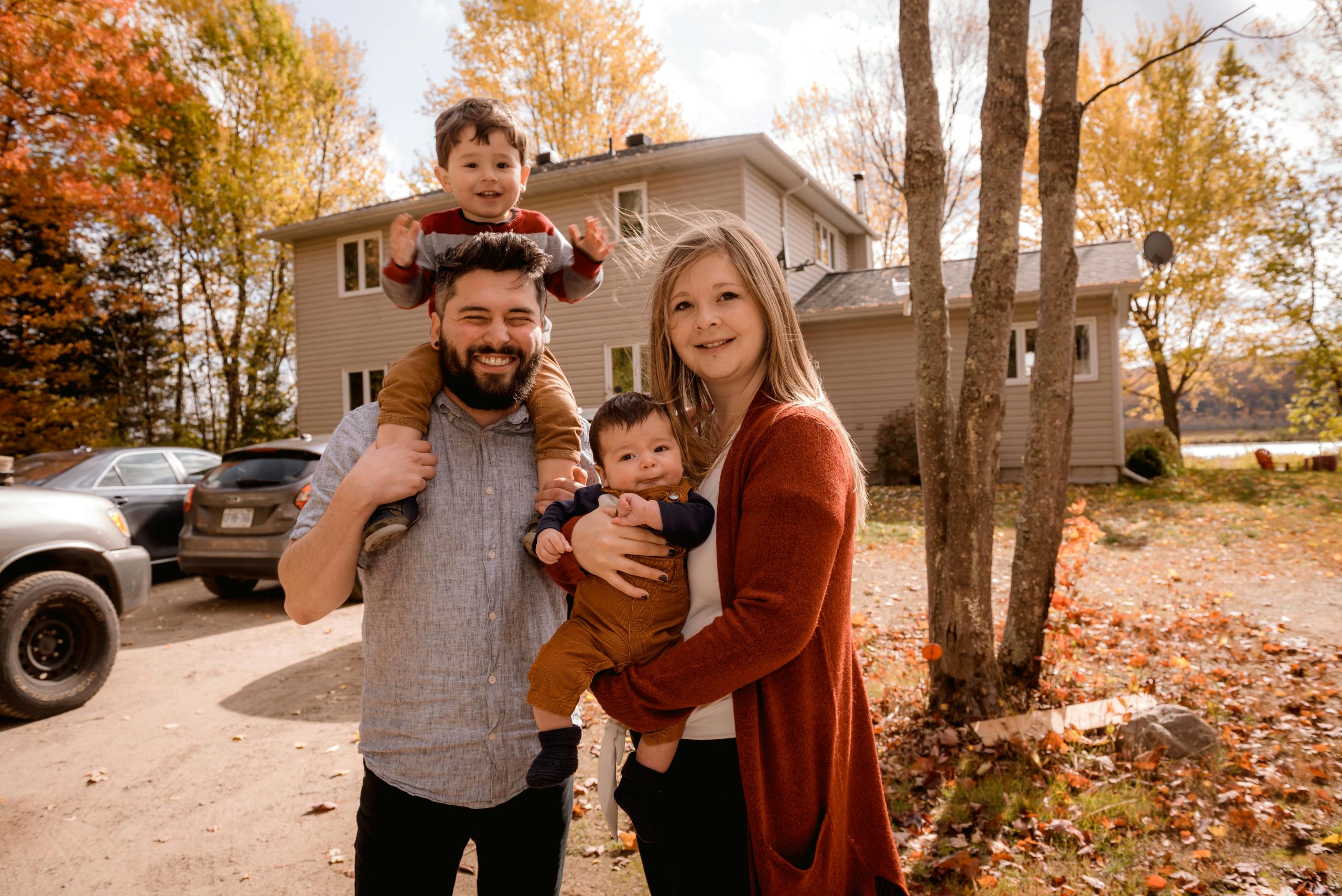 family in front of home