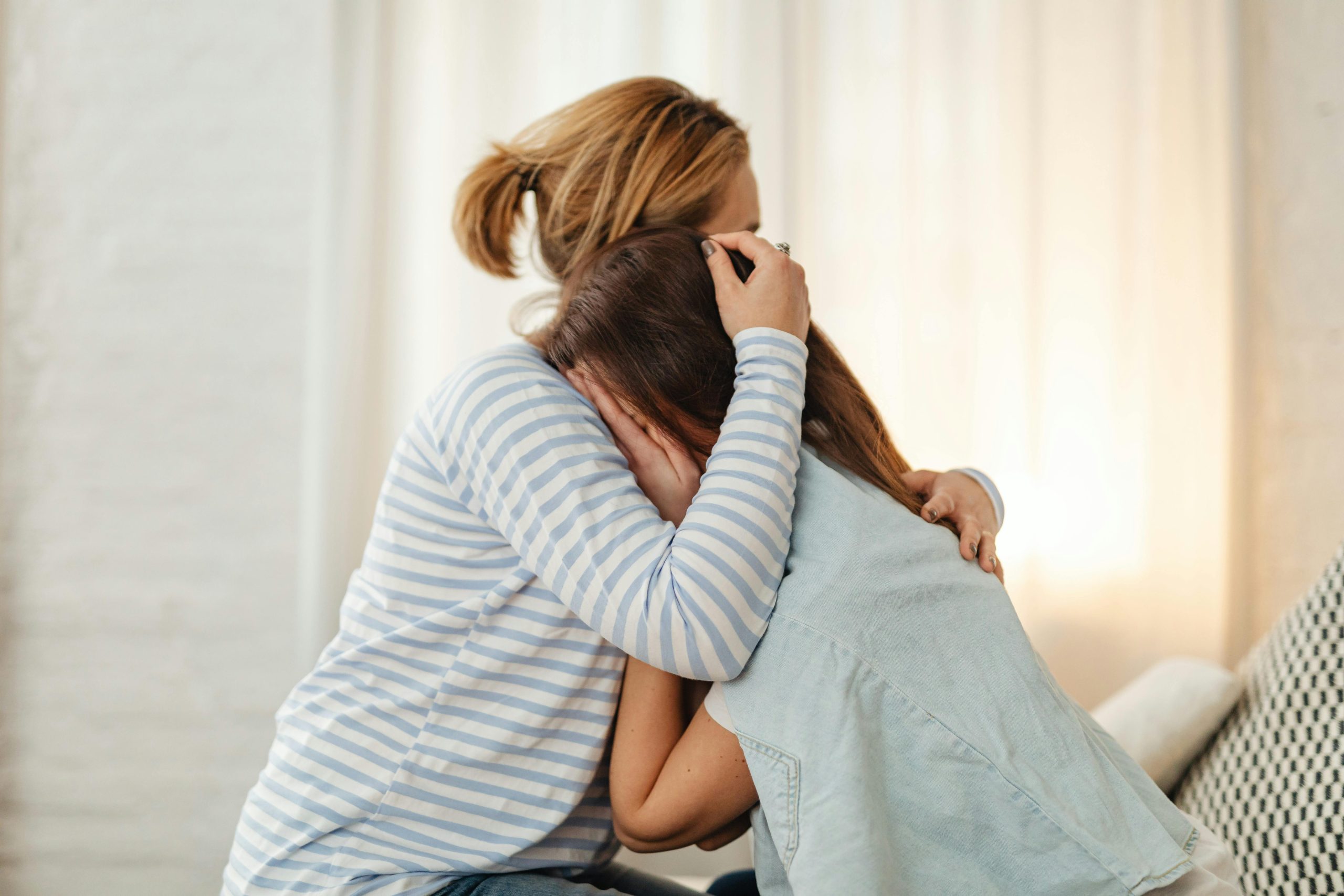 mom comforting a daughter during a traumatic situation